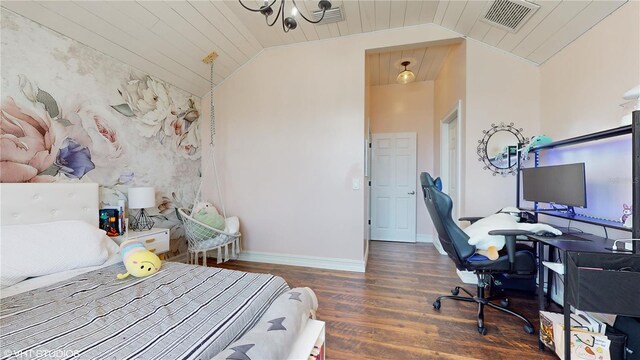 bedroom featuring vaulted ceiling, dark hardwood / wood-style floors, and a notable chandelier