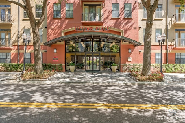 entrance to property with a balcony