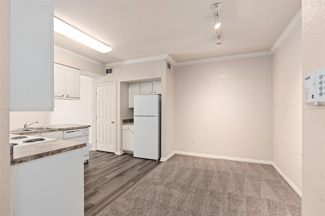 kitchen with ornamental molding, white appliances, white cabinets, and dark wood-type flooring