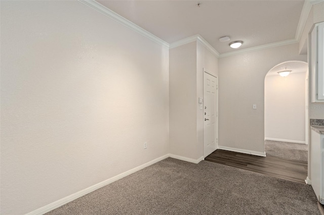 carpeted spare room featuring ornamental molding