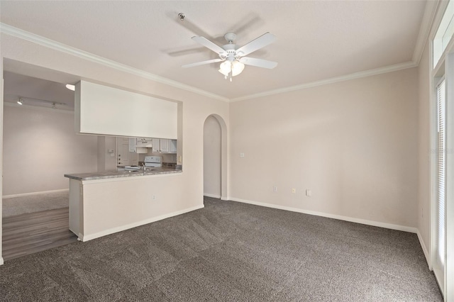 interior space featuring white cabinetry, crown molding, and kitchen peninsula