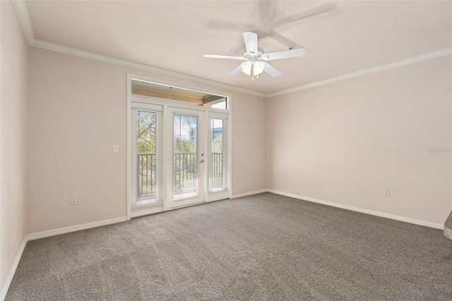 empty room featuring carpet, crown molding, a textured ceiling, and ceiling fan