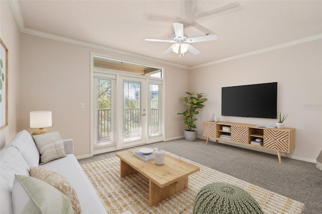 carpeted living room with ornamental molding and ceiling fan