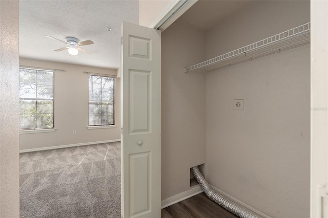 laundry room with light colored carpet, ceiling fan, and a textured ceiling