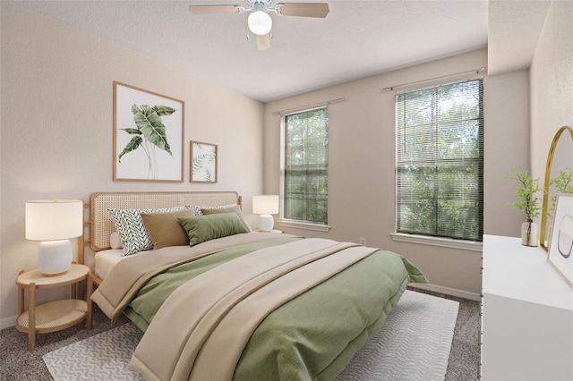 bedroom featuring ceiling fan, carpet flooring, and a textured ceiling