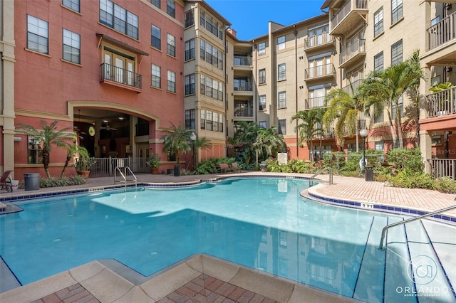 view of swimming pool with a patio