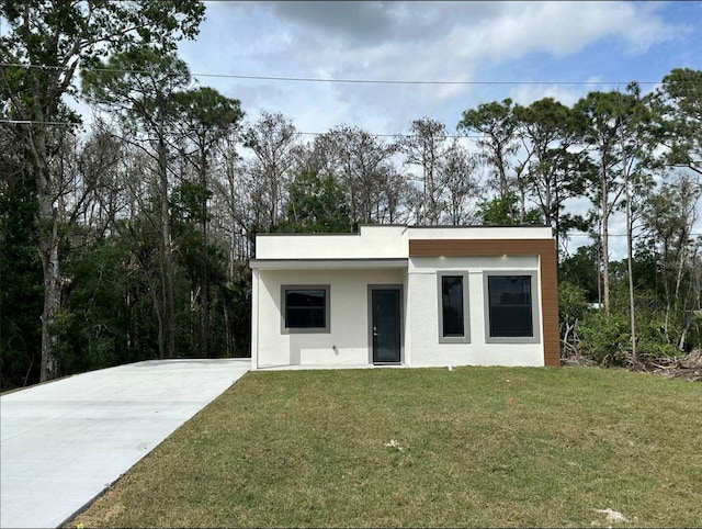 view of outdoor structure featuring a lawn