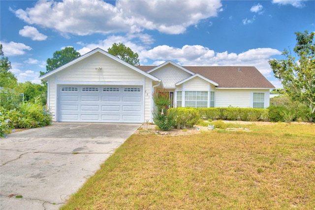 ranch-style home with a front yard and a garage