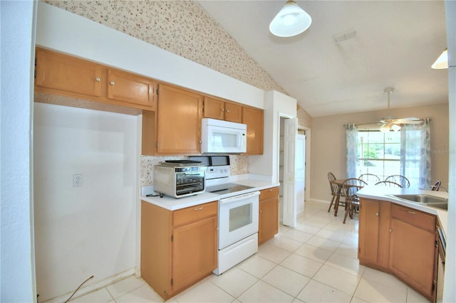 kitchen with ceiling fan, sink, white appliances, and hanging light fixtures