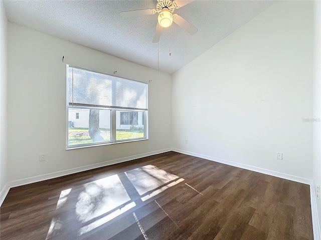 unfurnished room with a textured ceiling, ceiling fan, dark wood-type flooring, and lofted ceiling