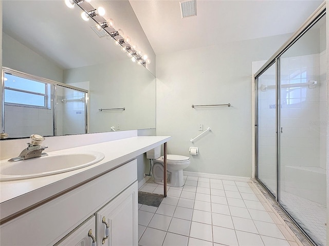 bathroom with tile patterned flooring, vaulted ceiling, toilet, vanity, and a shower with shower door