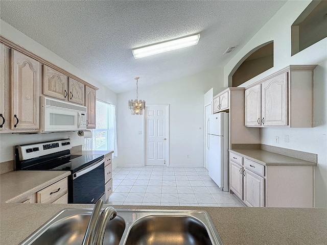 kitchen with pendant lighting, light brown cabinets, white appliances, vaulted ceiling, and a textured ceiling