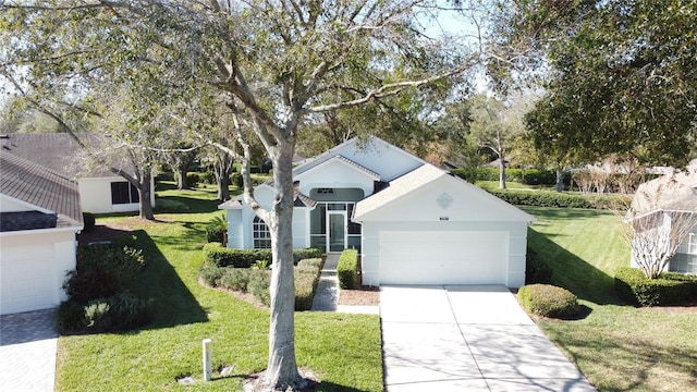 view of front of home with a garage and a front yard