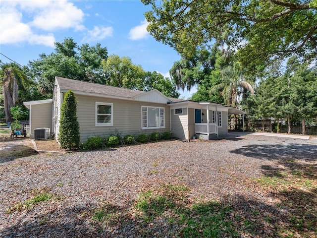 single story home featuring central air condition unit