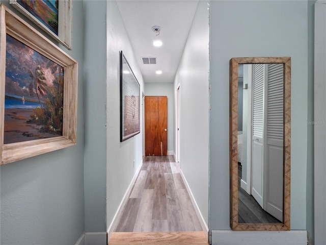 corridor featuring light hardwood / wood-style flooring