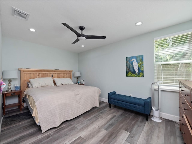 bedroom featuring ceiling fan and dark wood-type flooring