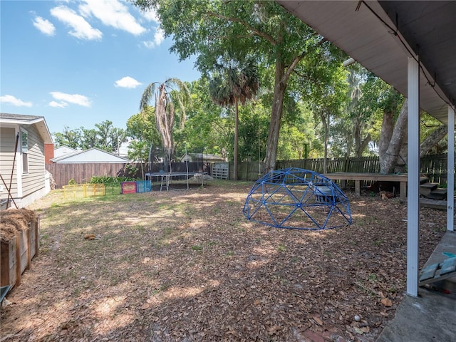 view of yard with a trampoline