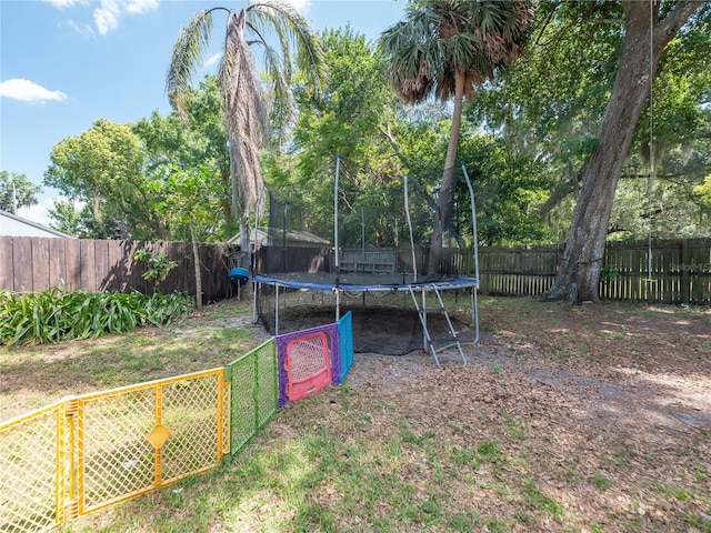 view of yard with a trampoline