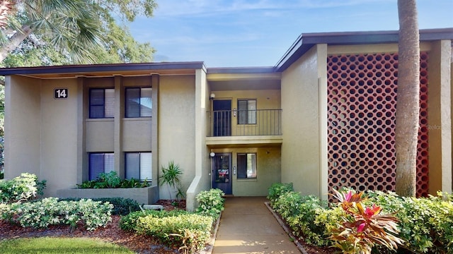 view of front of property with a balcony