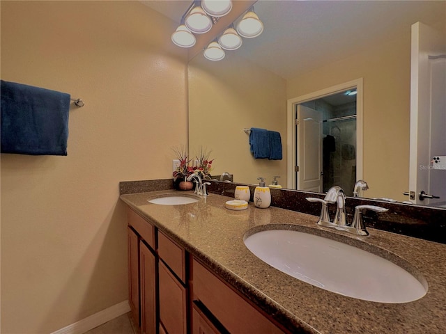 bathroom featuring walk in shower and vanity