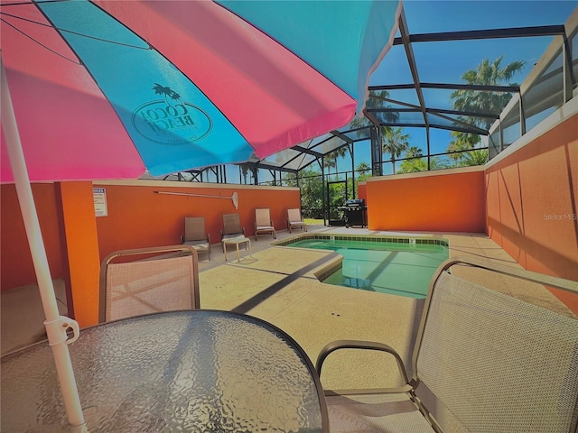 view of pool with a lanai and a patio area