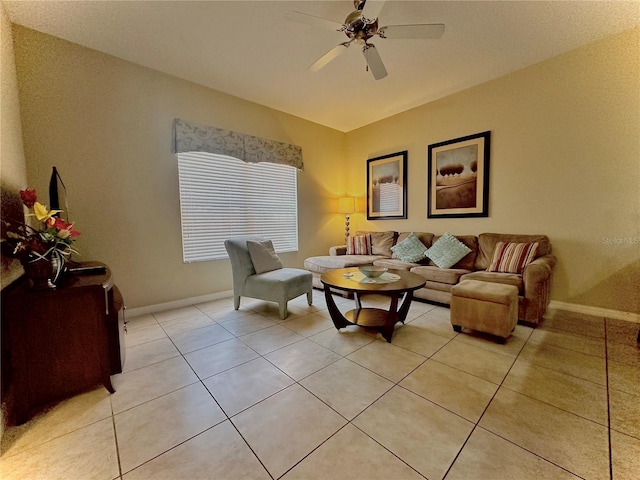 tiled living room with ceiling fan