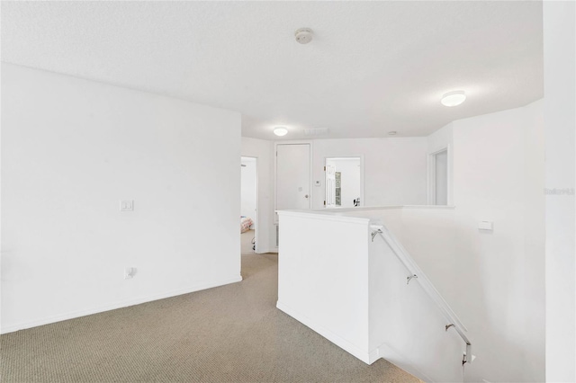 unfurnished room with light colored carpet