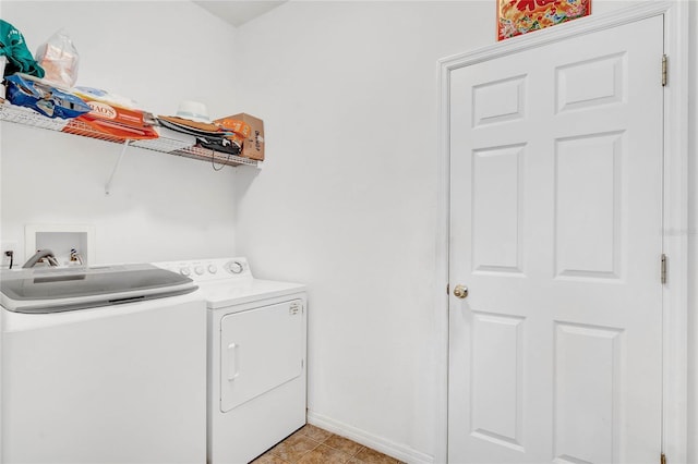 clothes washing area with separate washer and dryer