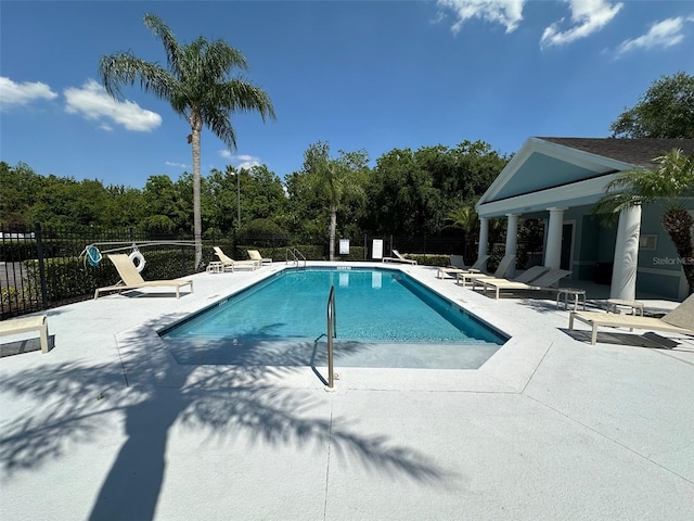 view of swimming pool with a patio