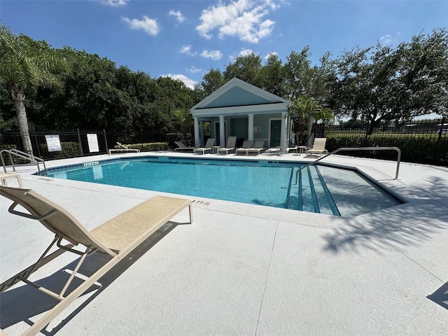 view of swimming pool with a patio area