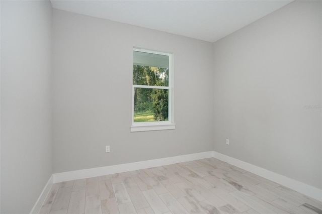 unfurnished room featuring light hardwood / wood-style floors