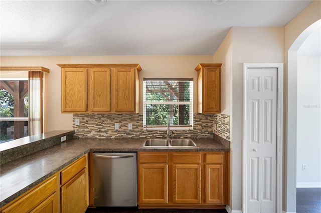 kitchen featuring dishwasher, tasteful backsplash, and plenty of natural light