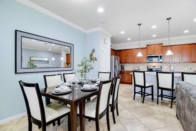 tiled dining space featuring crown molding