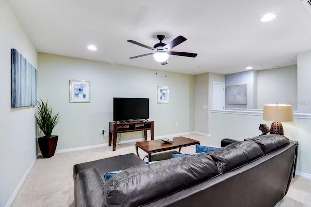 living room featuring carpet and ceiling fan