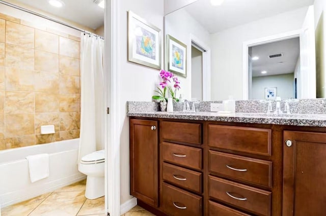 full bathroom featuring double sink vanity, tile flooring, shower / bath combination with curtain, and toilet