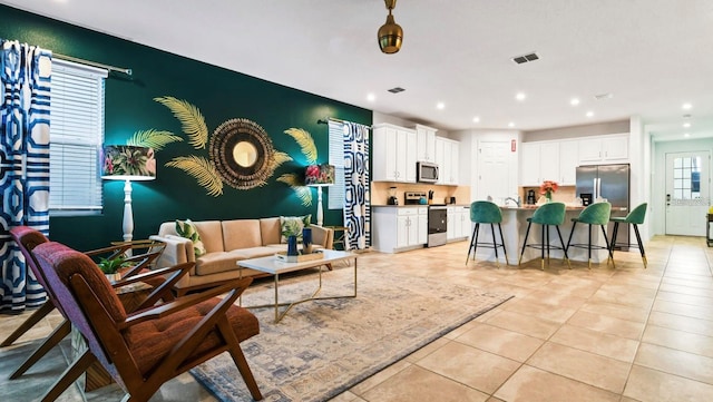 living room with light tile flooring