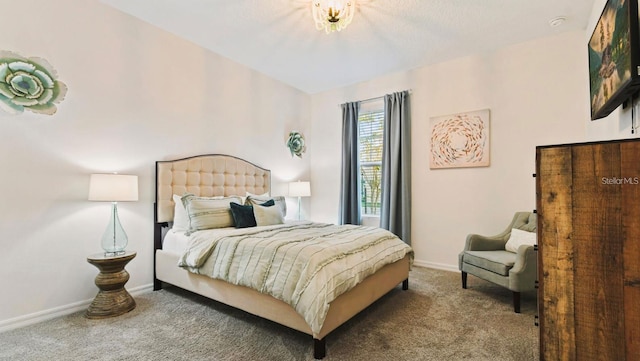 bedroom with dark colored carpet