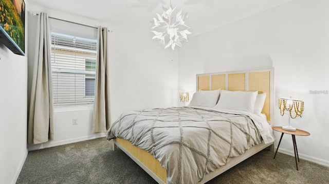 carpeted bedroom featuring an inviting chandelier