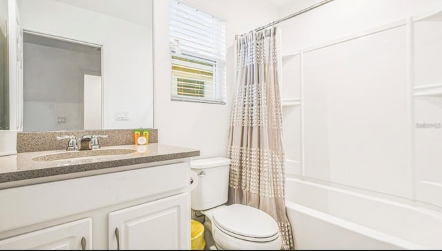 full bathroom with vanity, shower / bath combo, and toilet