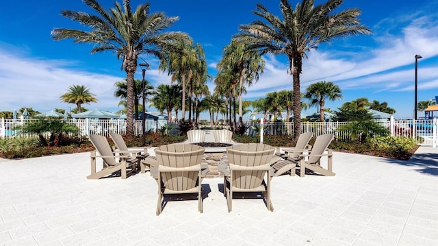 view of terrace featuring an outdoor fire pit