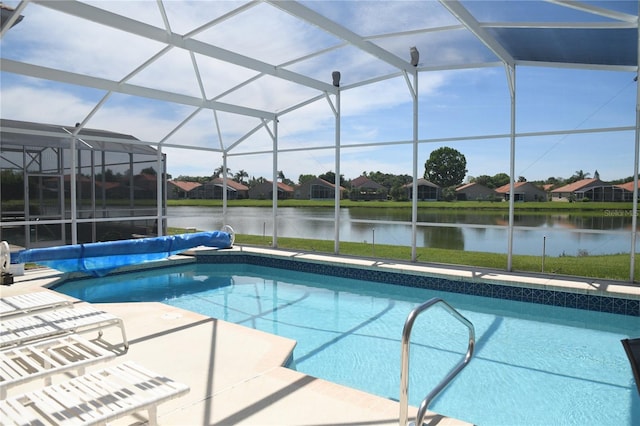 view of swimming pool featuring a patio area, a lanai, and a water view