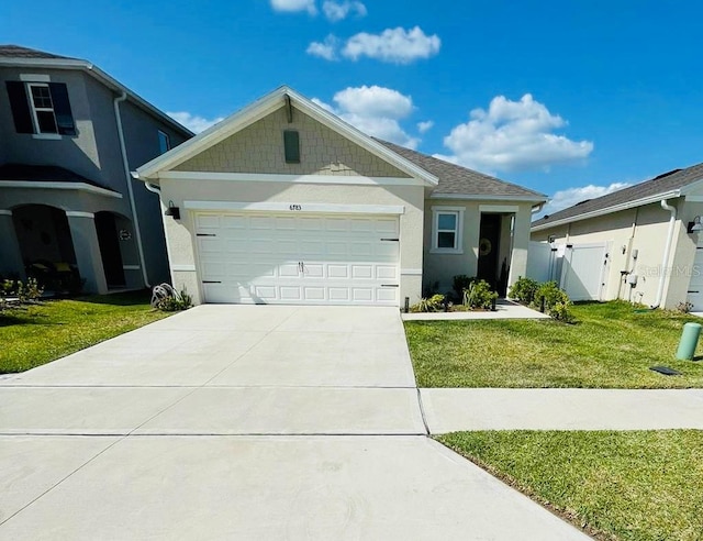 view of front of home with a garage and a front yard