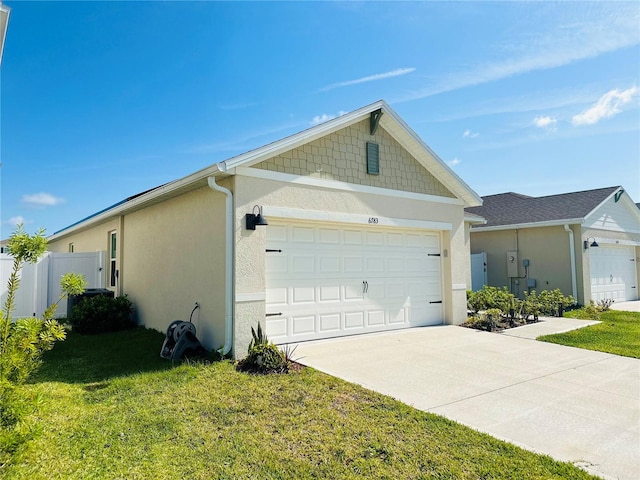 view of home's exterior with a yard and a garage