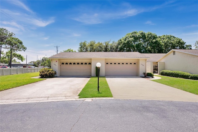 view of front facade featuring a front lawn and a garage