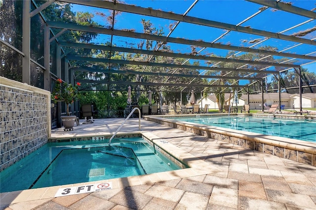 pool with a lanai and a patio