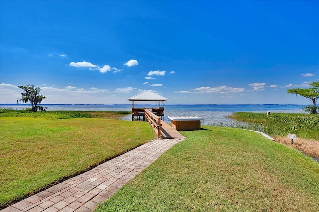 exterior space featuring a gazebo and a water view