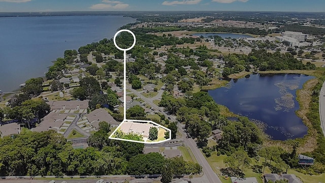 birds eye view of property featuring a water view and a residential view