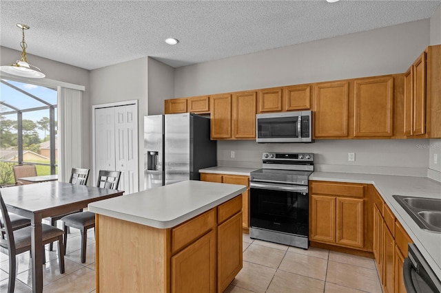 kitchen with hanging light fixtures, stainless steel appliances, a textured ceiling, sink, and light tile floors