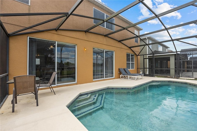 view of pool featuring a patio area and a lanai