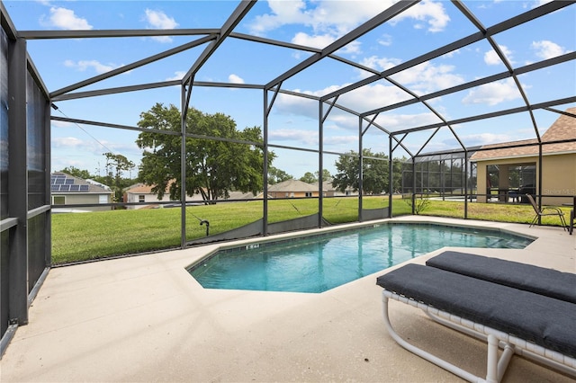 view of swimming pool with a lanai, a lawn, and a patio area